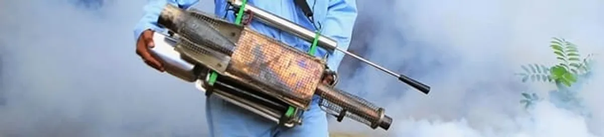 Fumigation technician using a fogger for deep pest treatment in Pittsburgh, PA